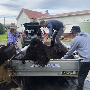 Jesse, Gavin and Graydon unloading potting mix