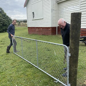 Gavin and Bruce hanging a gate for the rabbit proof fence